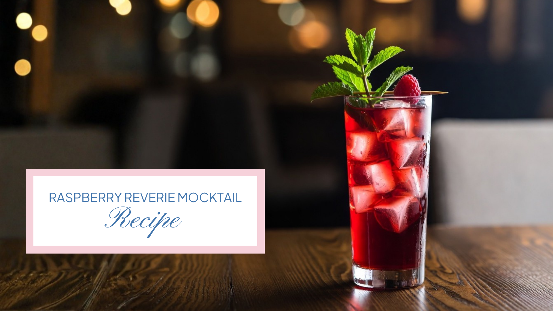 Raspberry Reverie Mocktail - Ruby-red raspberry mocktail recipe in a tall glass with lime, mint, and fresh raspberries.